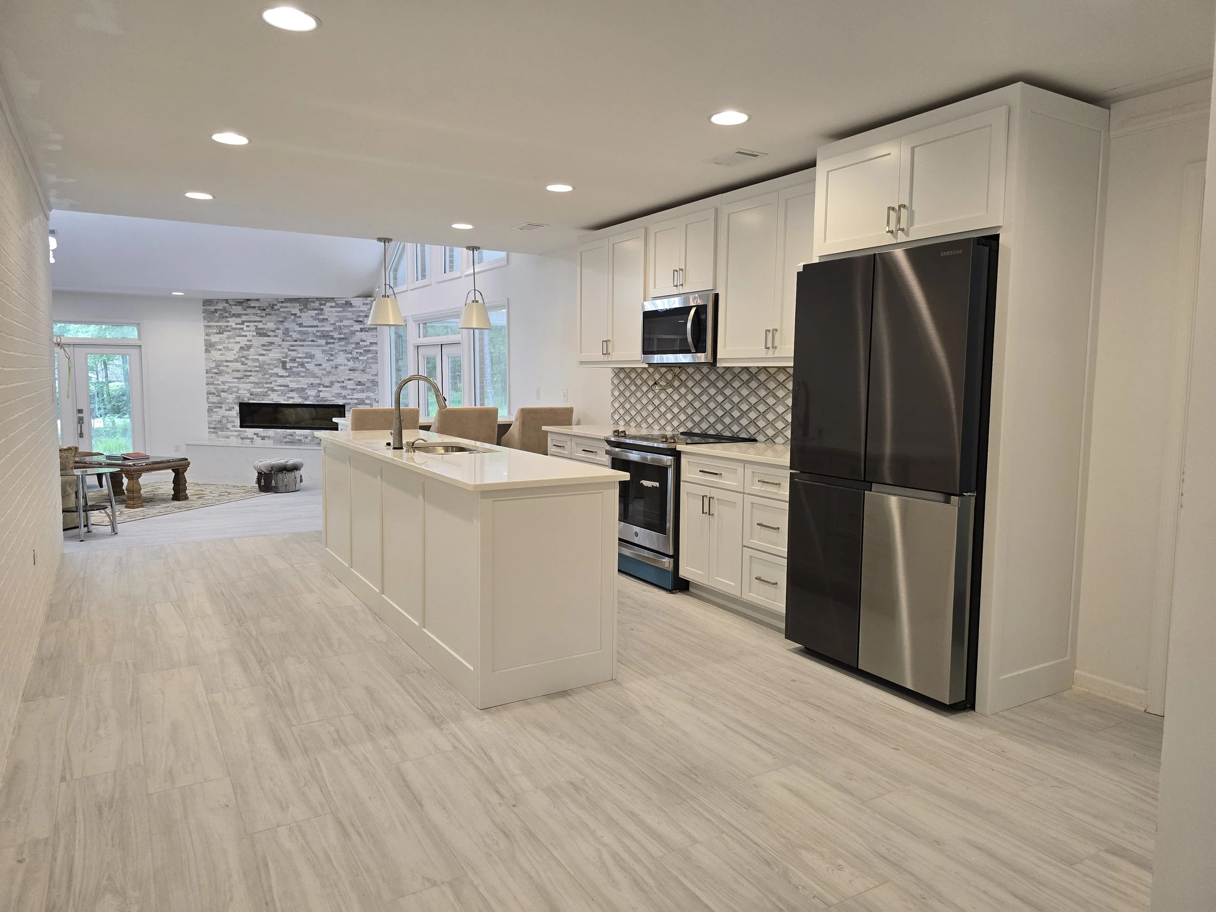 Custom kitchen remodel with white cabinetry and quartz countertops in Auburn AL